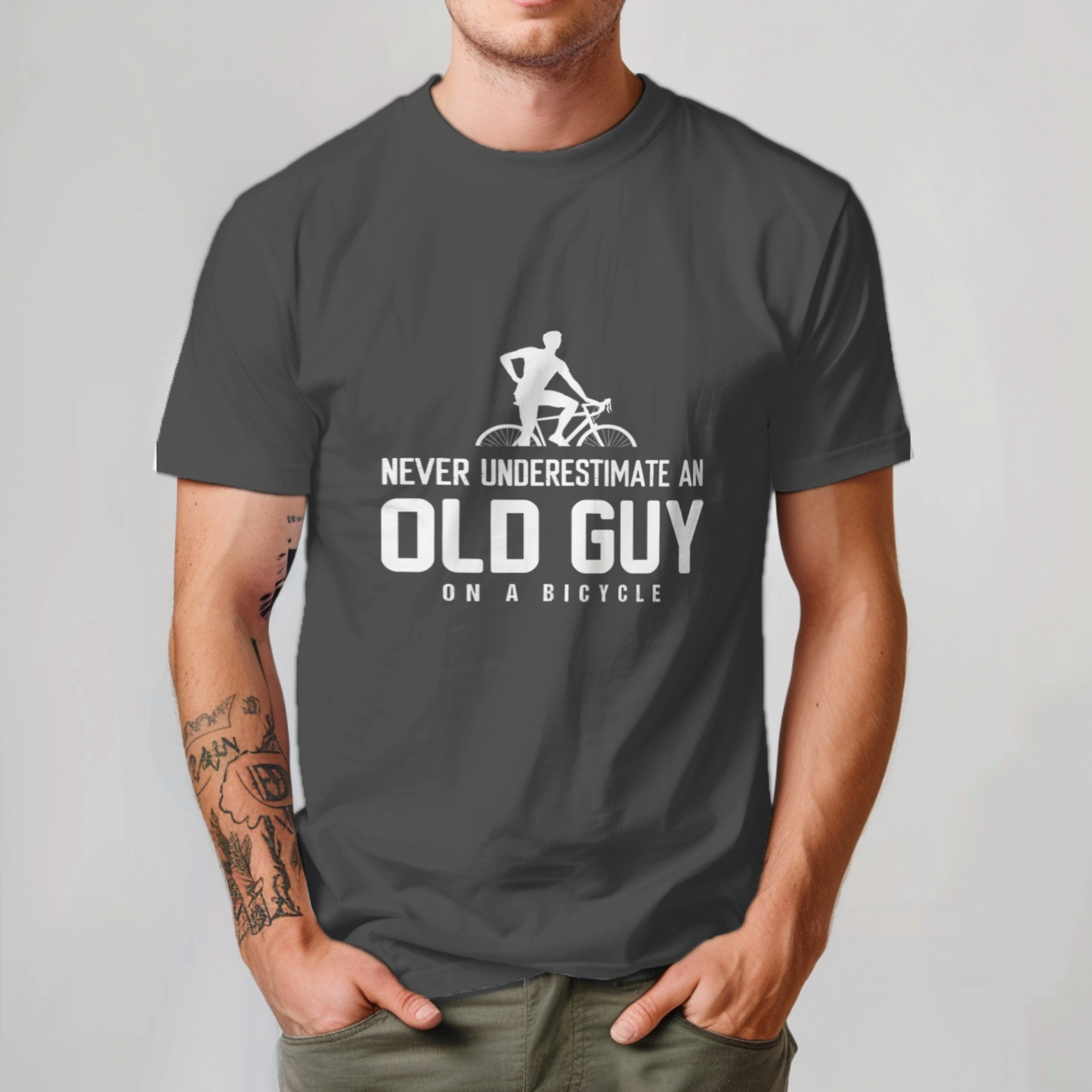 never underestimate an old guy on a bicycle tee